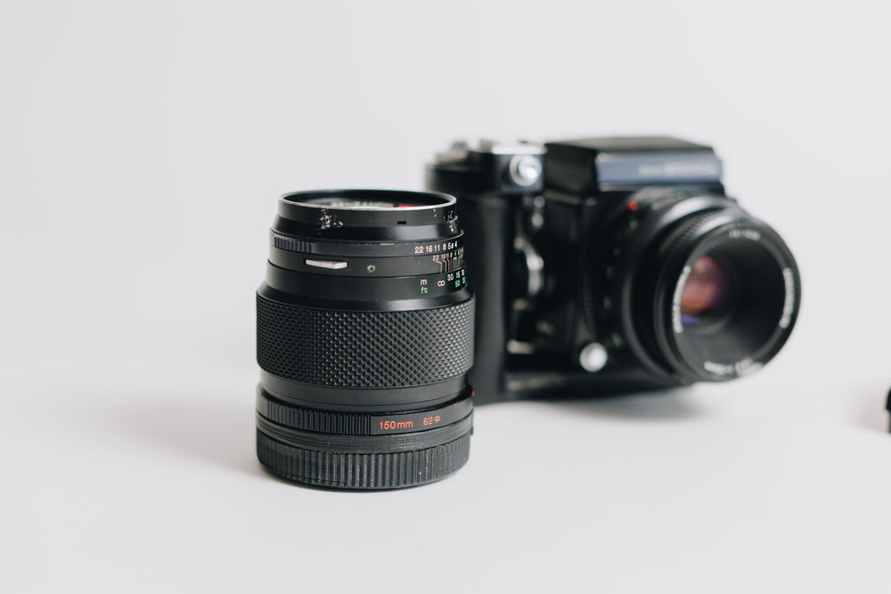 Bronica Zenza with two lenses 75mm F/2.8 and 150mm F/4 waistlevel viewfidner and prism viewfinder