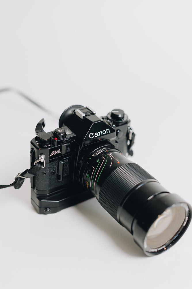 Canon A-1 with FD 28-90mm F/2.8 - 3.5 Lens with Battery Grip