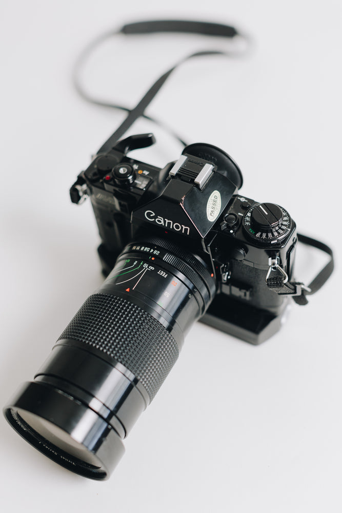 Canon A-1 with FD 28-90mm F/2.8 - 3.5 Lens with Battery Grip