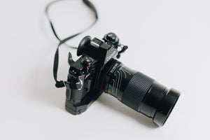 
            
                Load image into Gallery viewer, Canon A-1 with FD 28-90mm F/2.8 - 3.5 Lens with Battery Grip
            
        